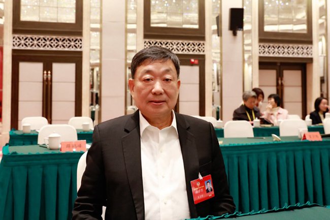 福建省政協(xié)常務(wù)委員、民建福建省委員會主委吳志明。受訪者供圖